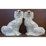 A pair of Staffordshire style dog figures, 31.