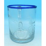 An early 19th Century continental mould blown glass beaker with wheel-cut decoration and blue rim,