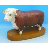 A Beswick Hereford Bull on stand