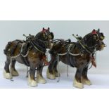 Two Beswick shire horses in full tackle