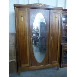 A 19th Century French Louis XV style inlaid mahogany and gilt metal mounted armoire
