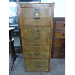 An early 20th Century oak four drawer filing cabinet