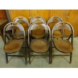 A set of six bentwood and crocodile skin effect folding chairs