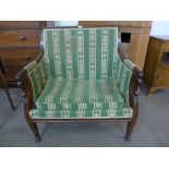 A 19th Century French mahogany and upholstered lovers seat