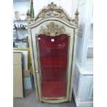 A French cream and parcel gilt vitrine