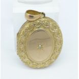 A diamond set yellow metal locket, 11.