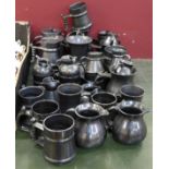 A collection of Prinknash pottery including a set of eight mugs, two water jugs, one a/f,