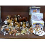 A large collection of boxer dog figures, four boxed, Coopercraft, Szeiler,