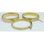 Three 1/5th 9ct gold, metal core bangles,
