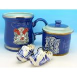 A studio pottery mug and lidded pot and a pair of small blue and white clogs