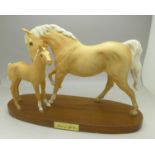 A Beswick horse group on stand,
