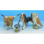 A Beswick model of an owl, a Beswick Great Wagtail, a West German figure of a Highland bull,