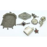 A small silver chain mail purse, two silver lockets, etc.