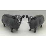 A Beswick Aberdeen Angus bull and cow