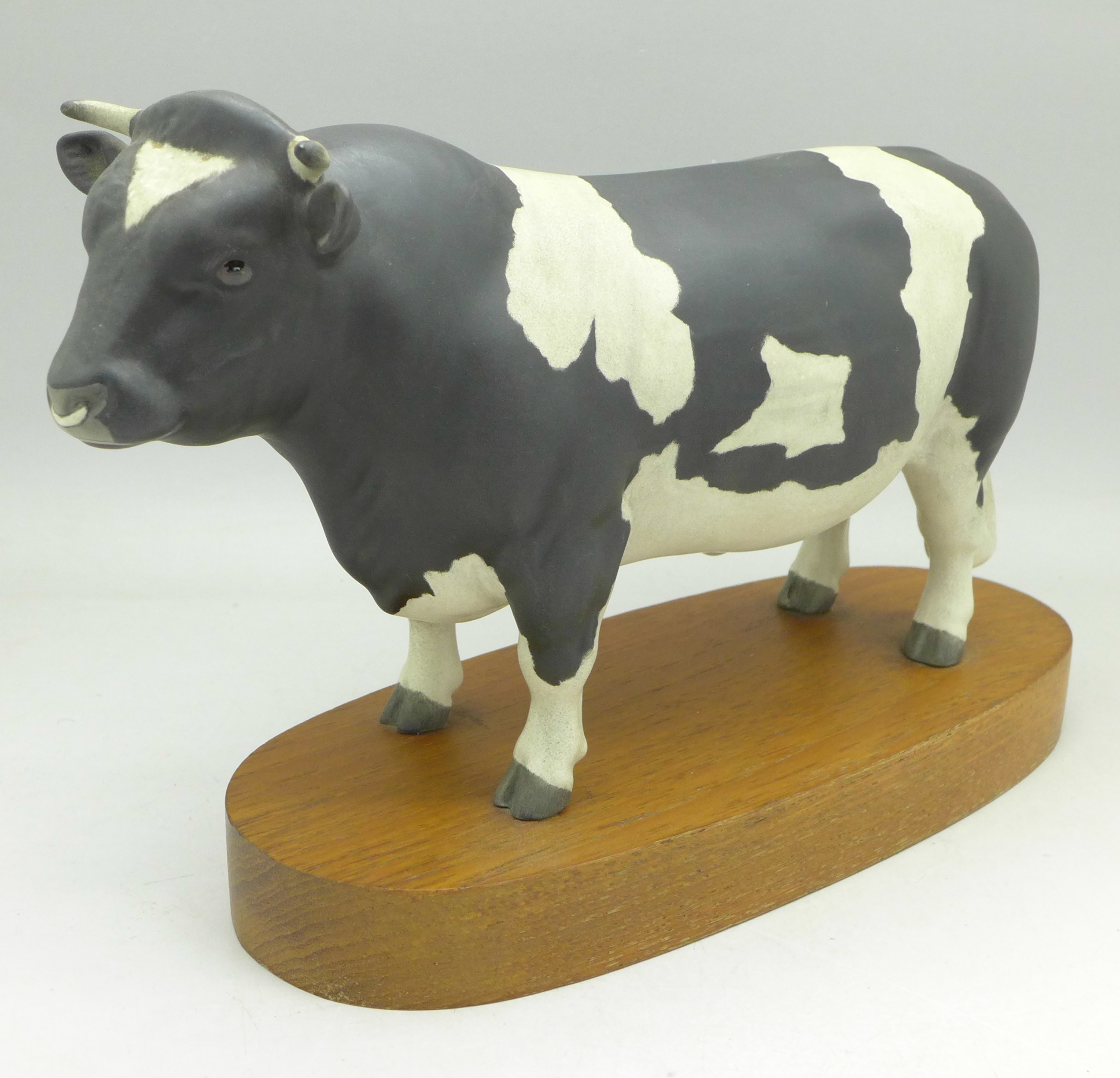 A Beswick Friesian Bull on stand, Champion Coddington Hilt Bar,