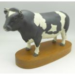 A Beswick Friesian Bull on stand, Champion Coddington Hilt Bar,