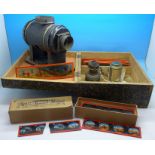 A boxed magic lantern with a box of slides and loose slides,
