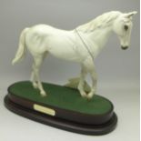 A Royal Doulton racehorse on stand,