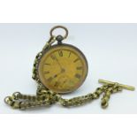 A pocket watch with fancy link Albert chain