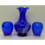 Three blue glass vases