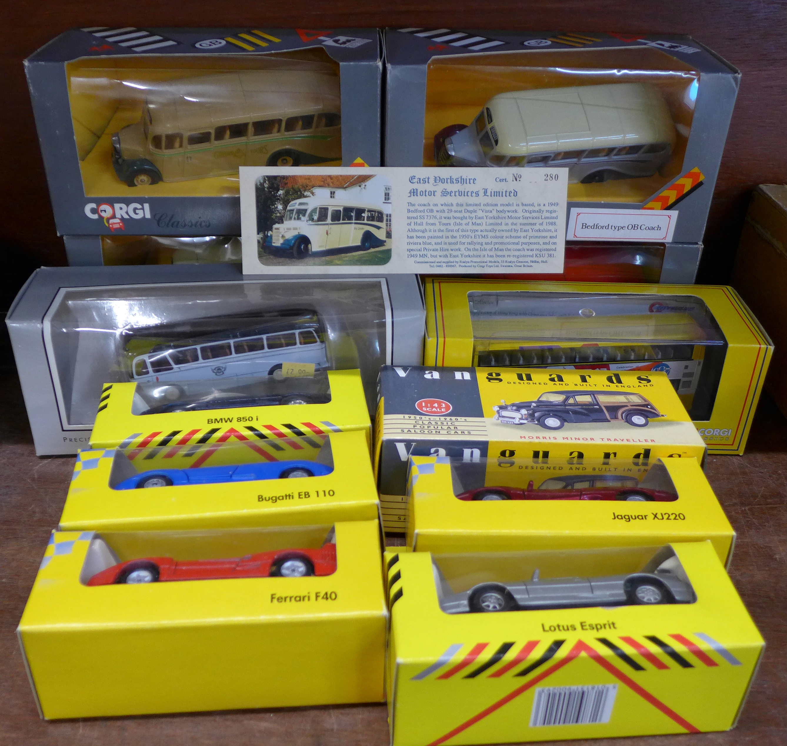 Twelve Corgi and Maisto model vehicles,