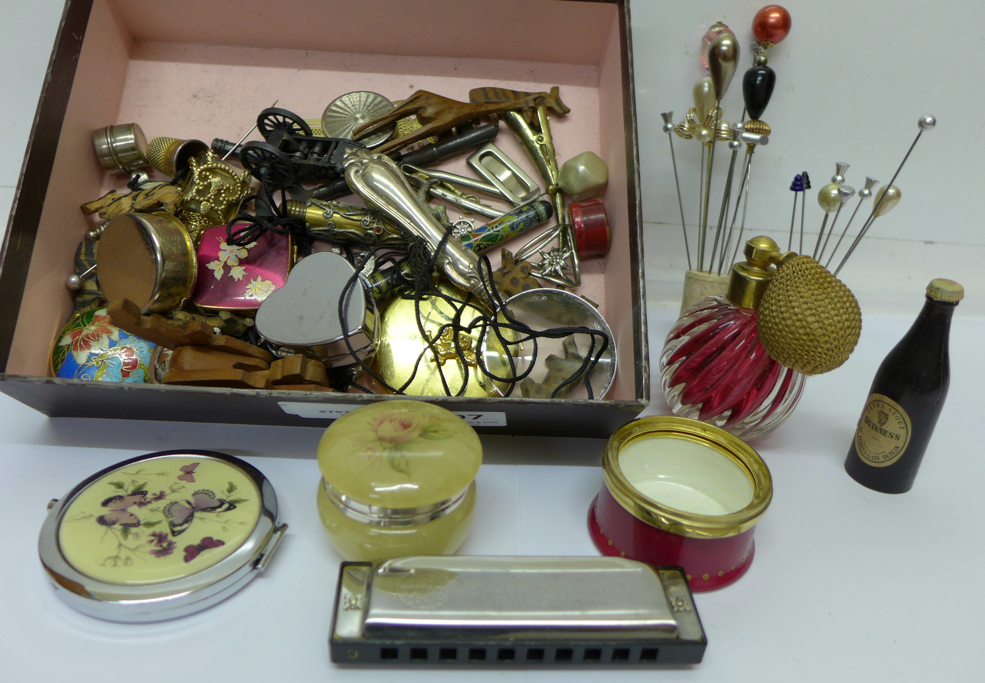 Hat pins, magnifying glass, harmonica, compacts, perfume bottles, etc.