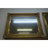 A gilt framed mirror