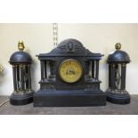 A 19th Century French Belge noir clock garniture, the movement signed Vincenti & Cie.