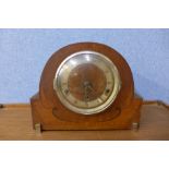 An inlaid walnut mantel clock