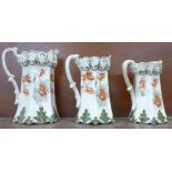 A set of three graduated jugs, c.