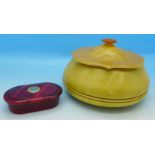 A red Bakelite box and a yellow Bakelite powder pot