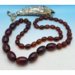 An abalone reticulated fish and a bead necklace