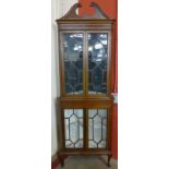 An Edward VII inlaid mahogany freestanding corner cabinet