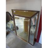 A Victorian mahogany cushion shaped framed mirror