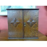 An Edward VII oak smokers cabinet