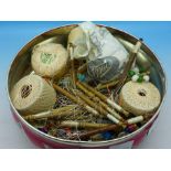 A collection of lace bobbins with beads