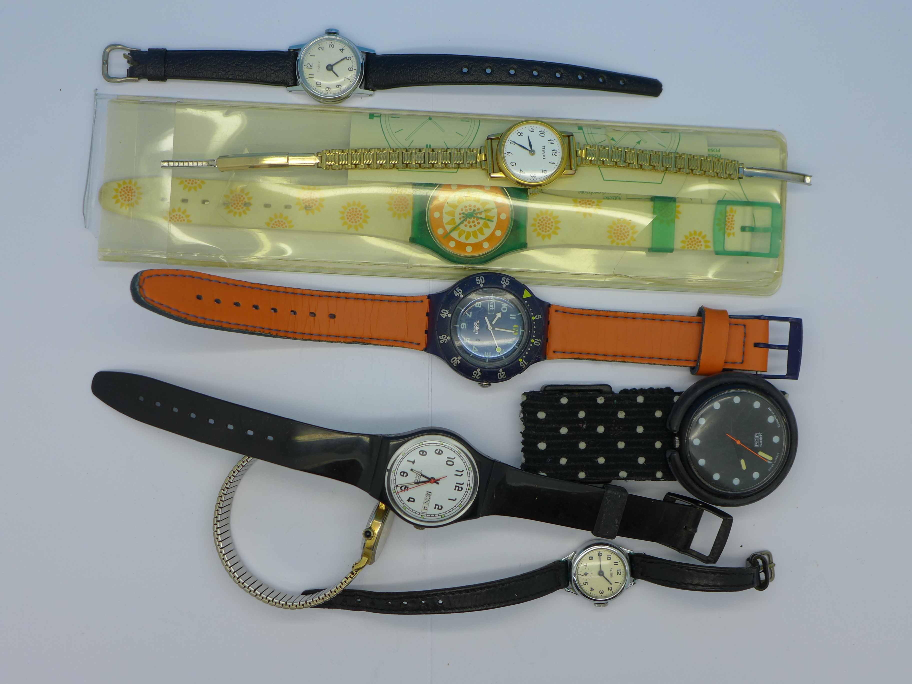 Two Swatch wristwatches and other wristwatches
