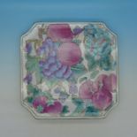 A Chinese square dish decorated with fruit, four character mark to base,