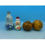 Two small Chinese snuff bottles and two carved nuts