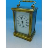 A French brass and four glass sided carriage clock,