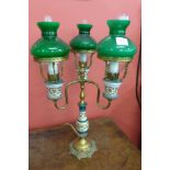 A Victorian style porcelain and brass table lamp