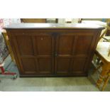 A Victorian pine two door school cupboard