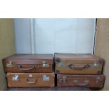 Four vintage suitcases