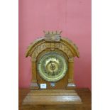 An early 20th Century American Ansonia oak mantel clock