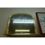 A gilt framed overmantel mirror