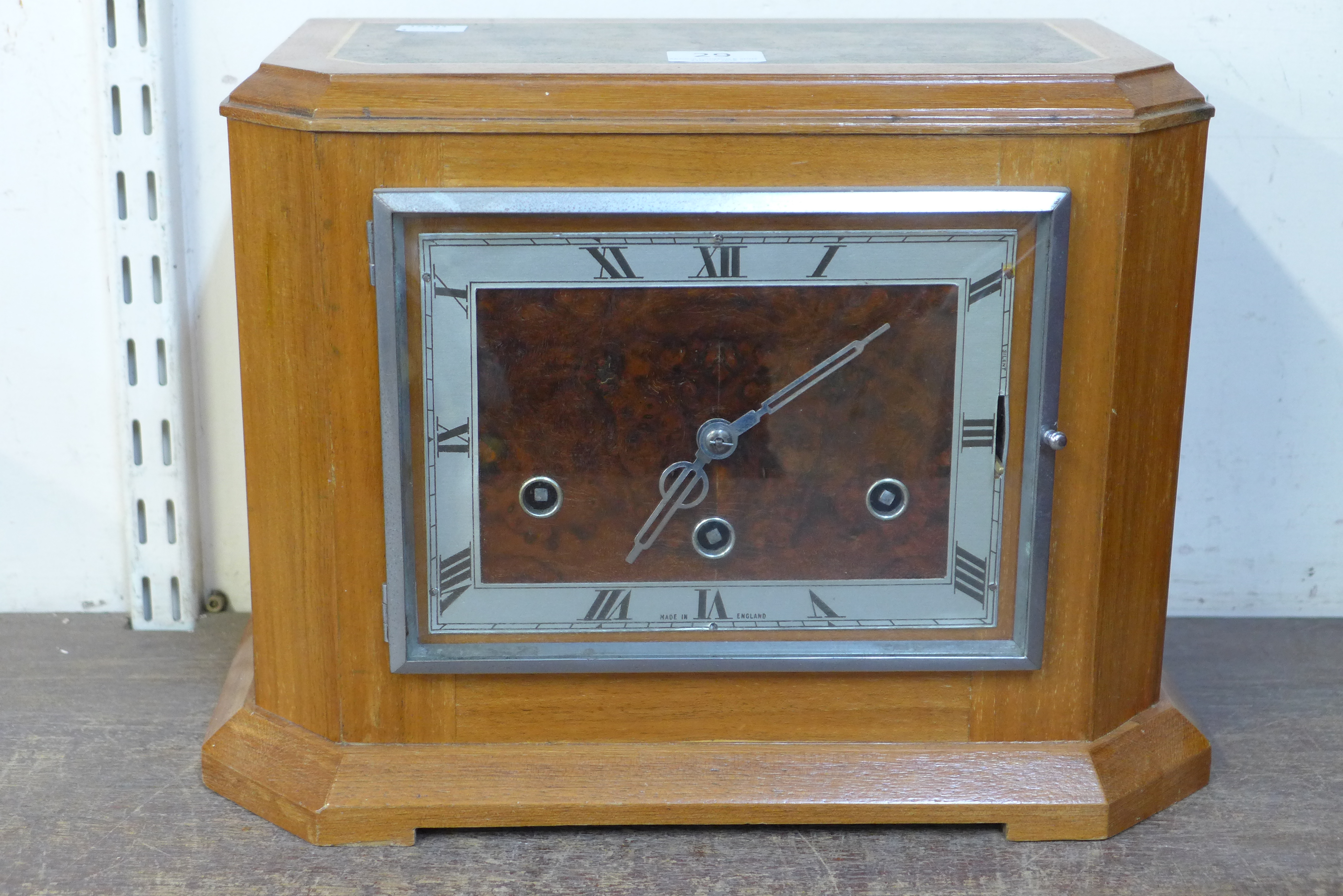 An Art Deco walnut mantel clock