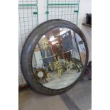 A large industrial style circular mirror