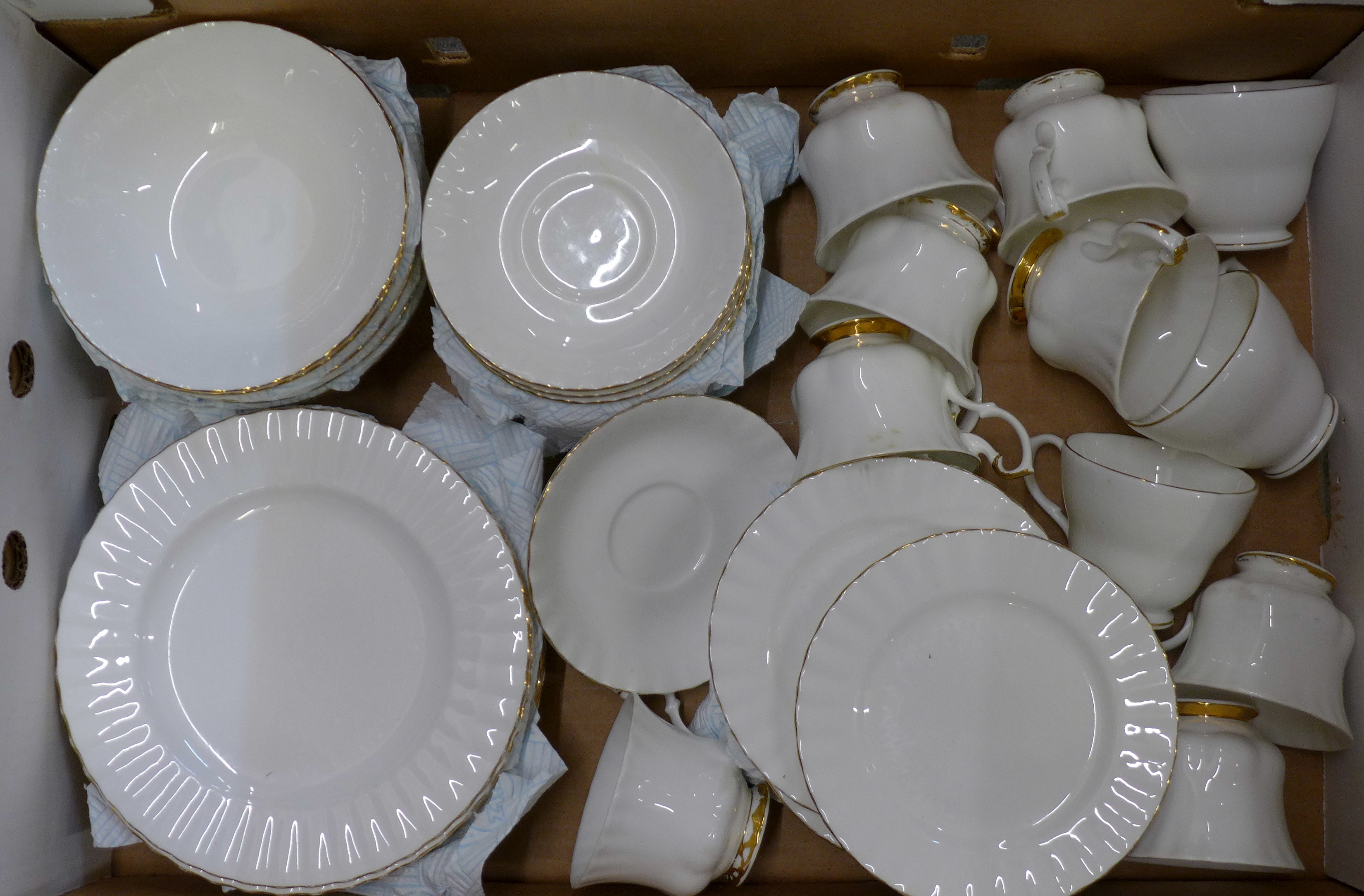 A Royal Albert Val D'Or tea service, comprising eleven cups, eleven saucers, twelve side plates,