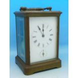 A brass and four glass sided alarm carriage clock, height 13cm,