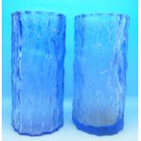 A pair of textured bark blue glass vases, 20.